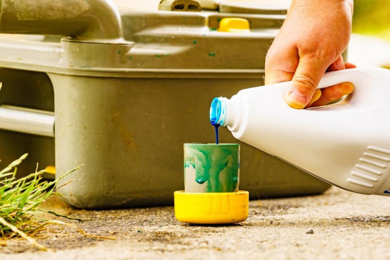 Adding chemical toilet treatment to an RV black watertank