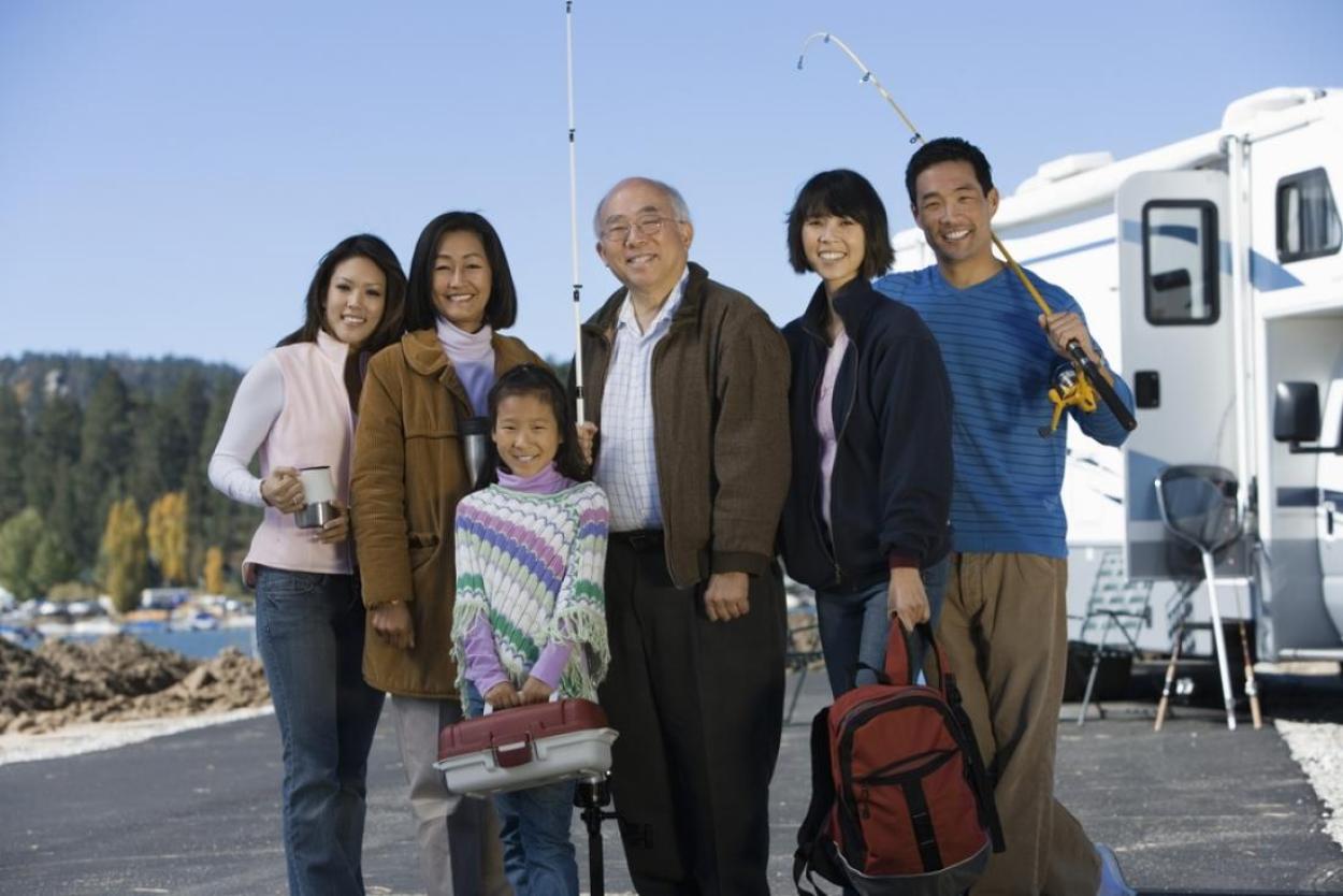 Happy family outside an RV