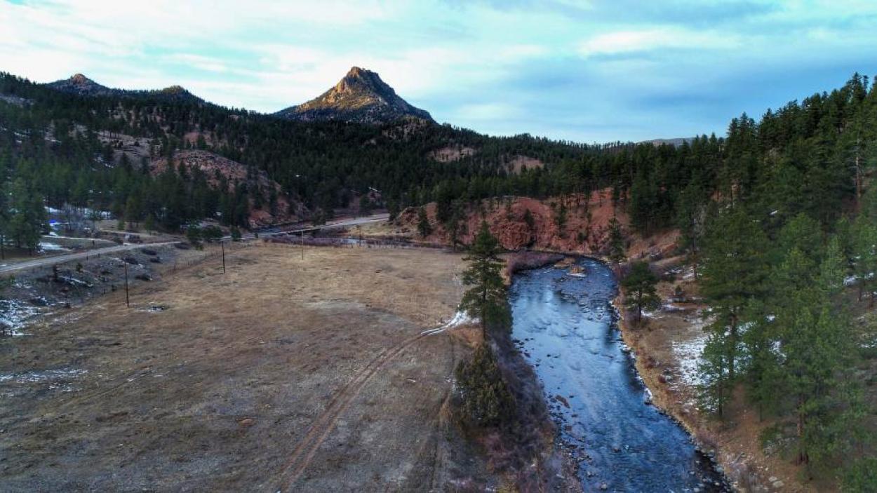 Mountain and creek with trails around it in Sedalia, CO