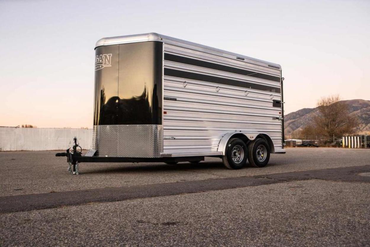 Small bumper pull livestock trailer in a parking lot