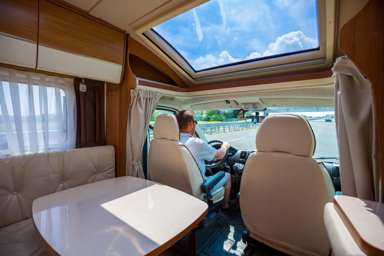 Interior shot of a man driving an RV