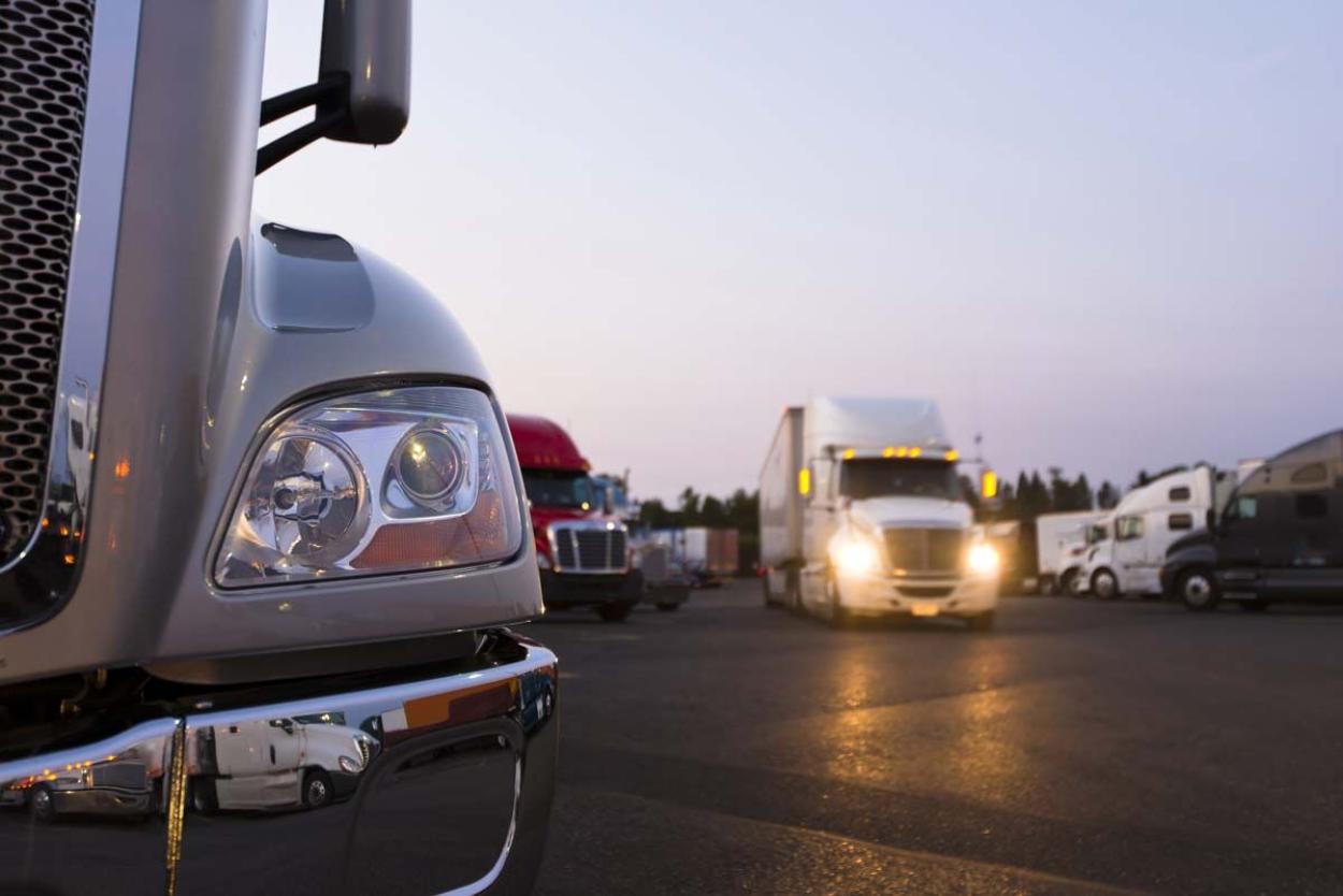 Semi trucks parked in the evening