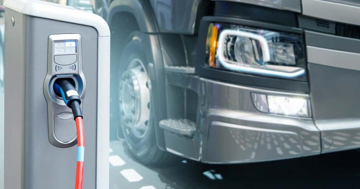 Semi truck at an electric charging station