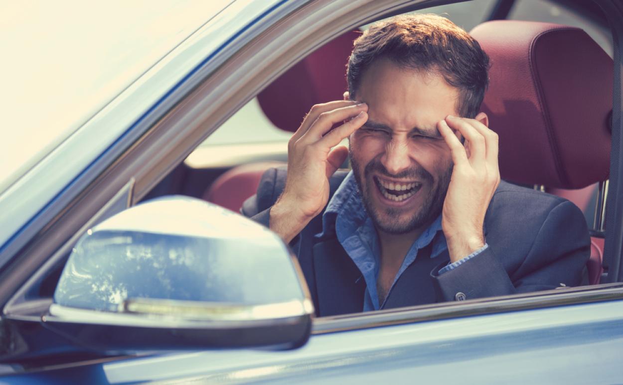 Stressed driver covering their face