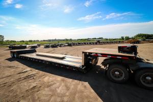 Drop deck trailer parked outside and unhitched