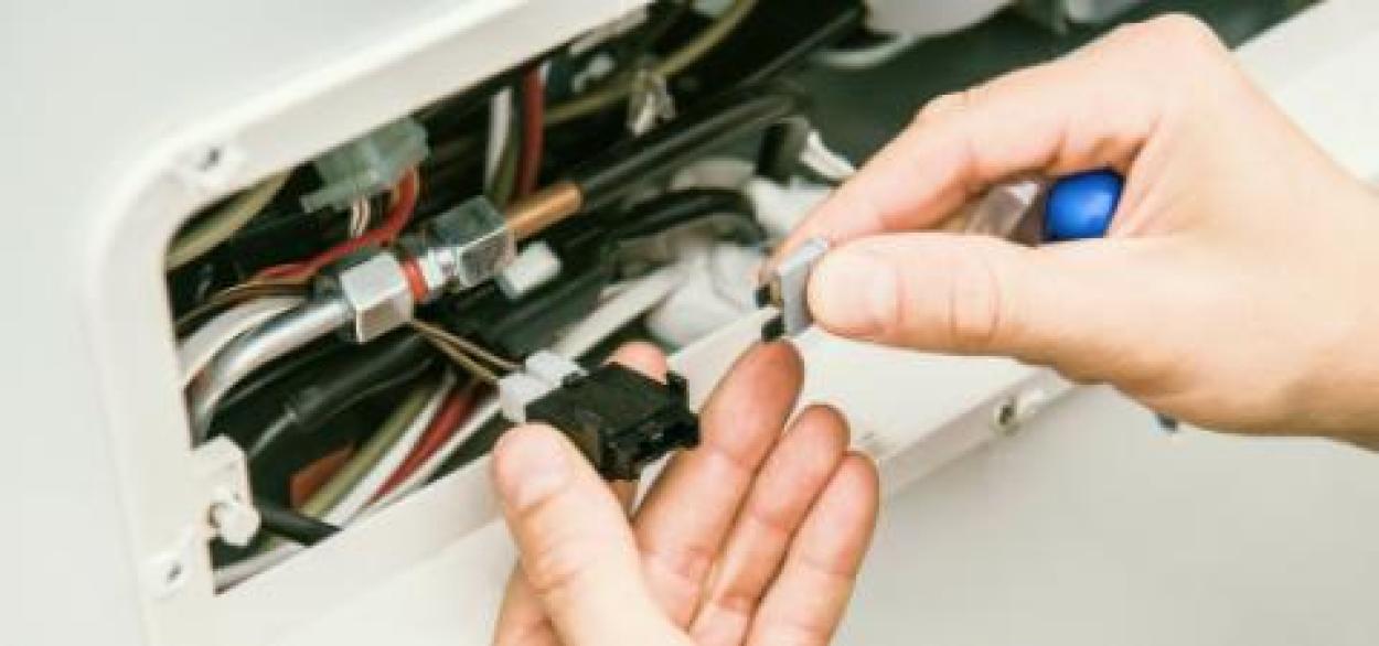 Hands fixing vehicle electrical wires