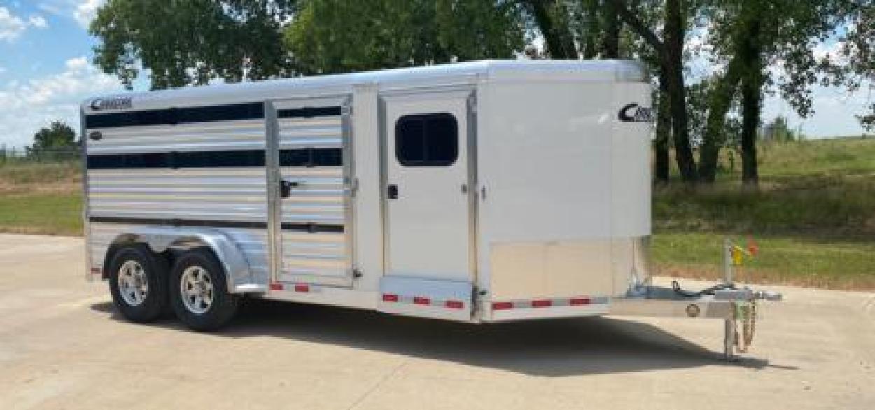 Unhitched horse trailer parked outside