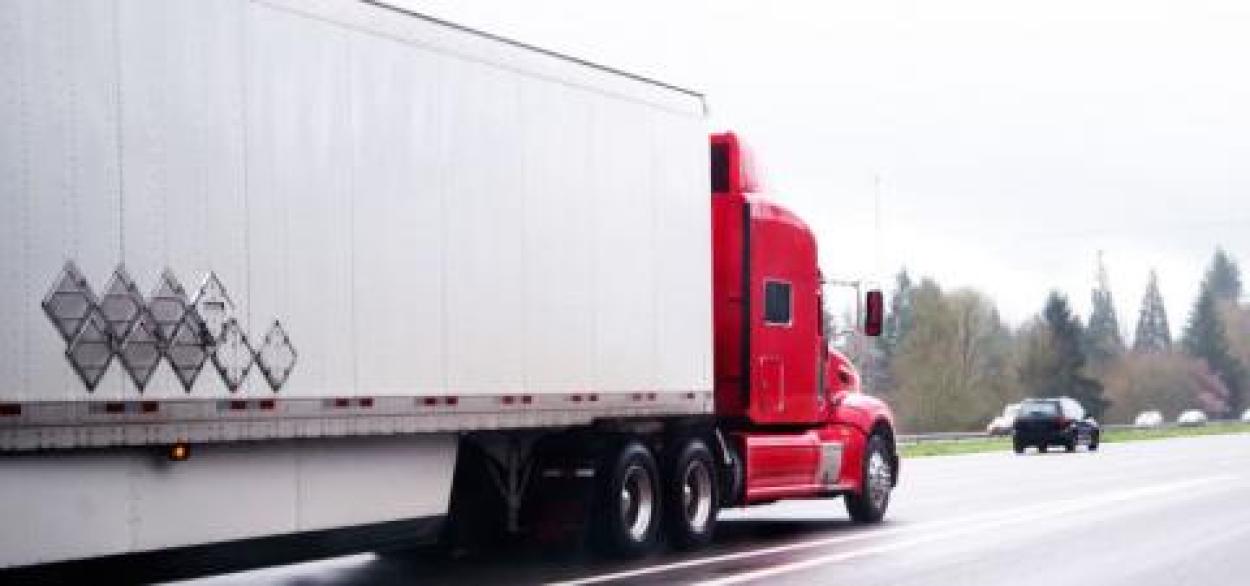 Semi truck with trailer on the road