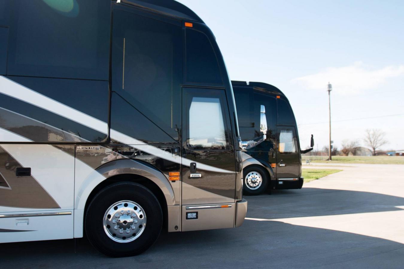 A side exterior shot of the front of an Emerald Luxury Coach RV