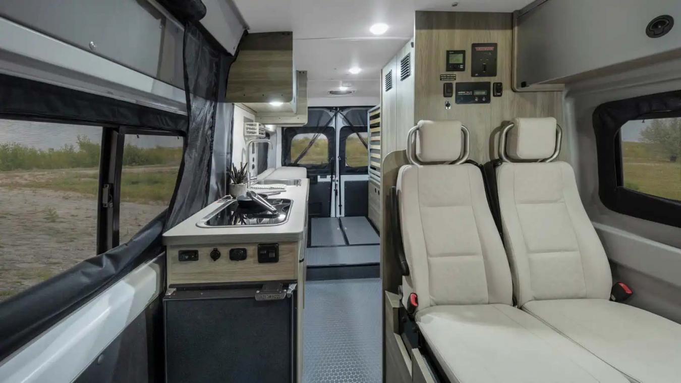 Interior view facing back in a 2023 Winnebago Solis RV