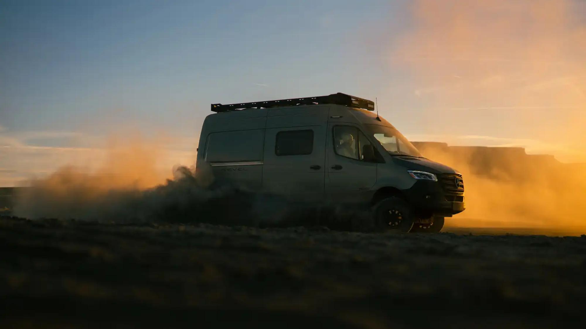 Exterior view of a 2024 Revel driving off-grid at sunset