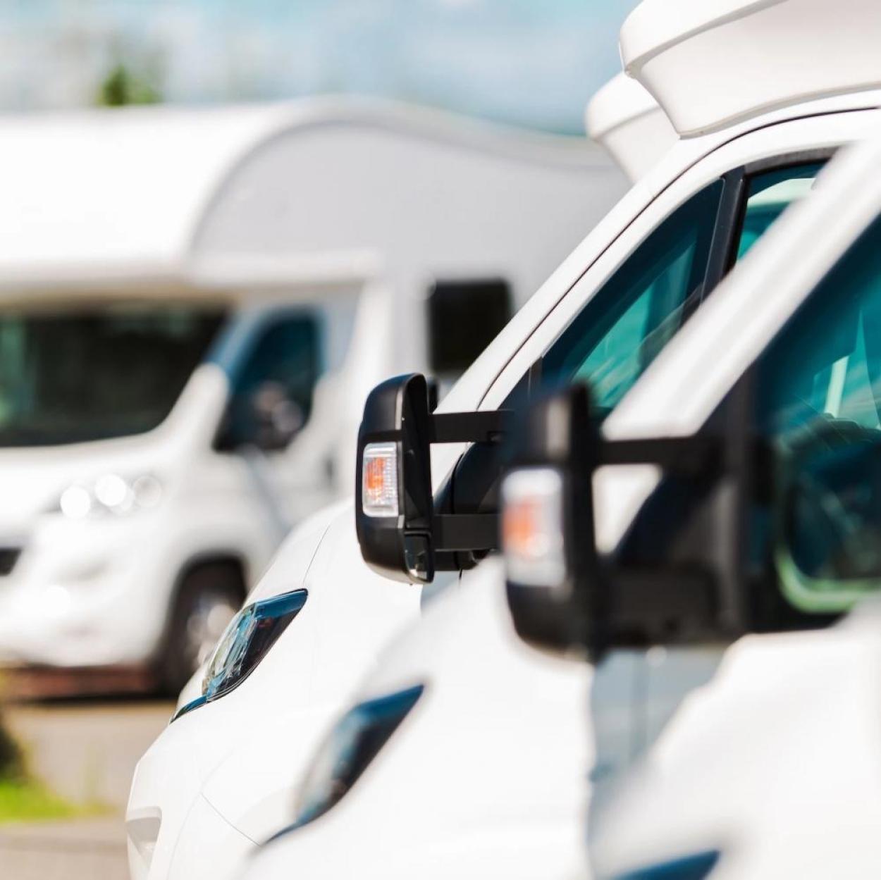 A row of white RVs